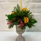 Orange & Berry Christmas Foliage Arrangement in Cement Urn with Candle