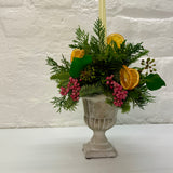Orange & Berry Christmas Foliage Arrangement in Cement Urn with Candle