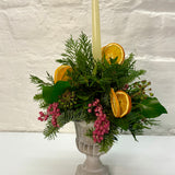Orange & Berry Christmas Foliage Arrangement in Cement Urn with Candle