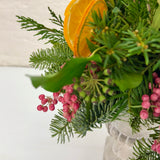 Orange & Berry Christmas Foliage Arrangement in Cement Urn with Candle