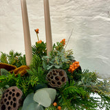 Peach Ilex & Mixed Foliage Christmas Table Arrangement with Luxury Velvet Bow